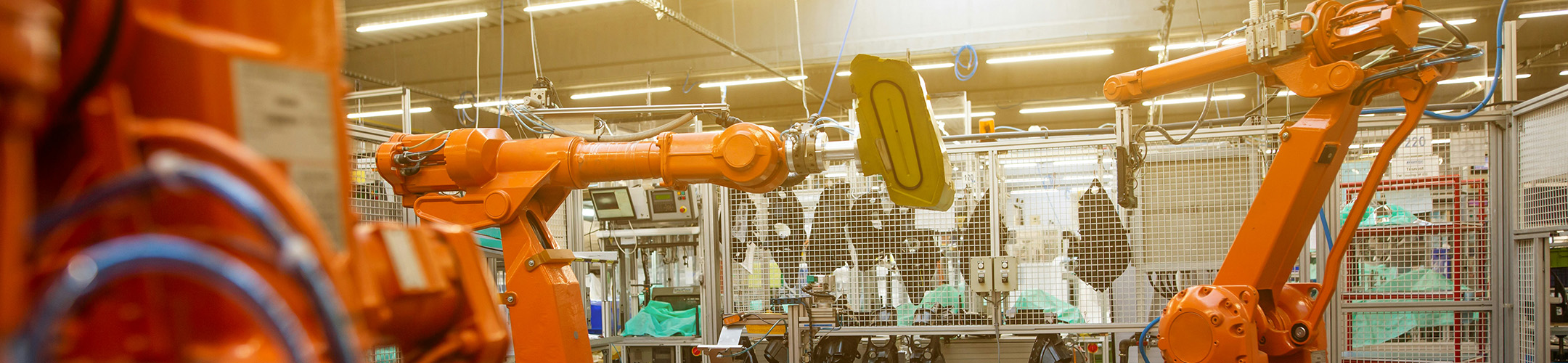 Automated manufacturing plant with robotic arms